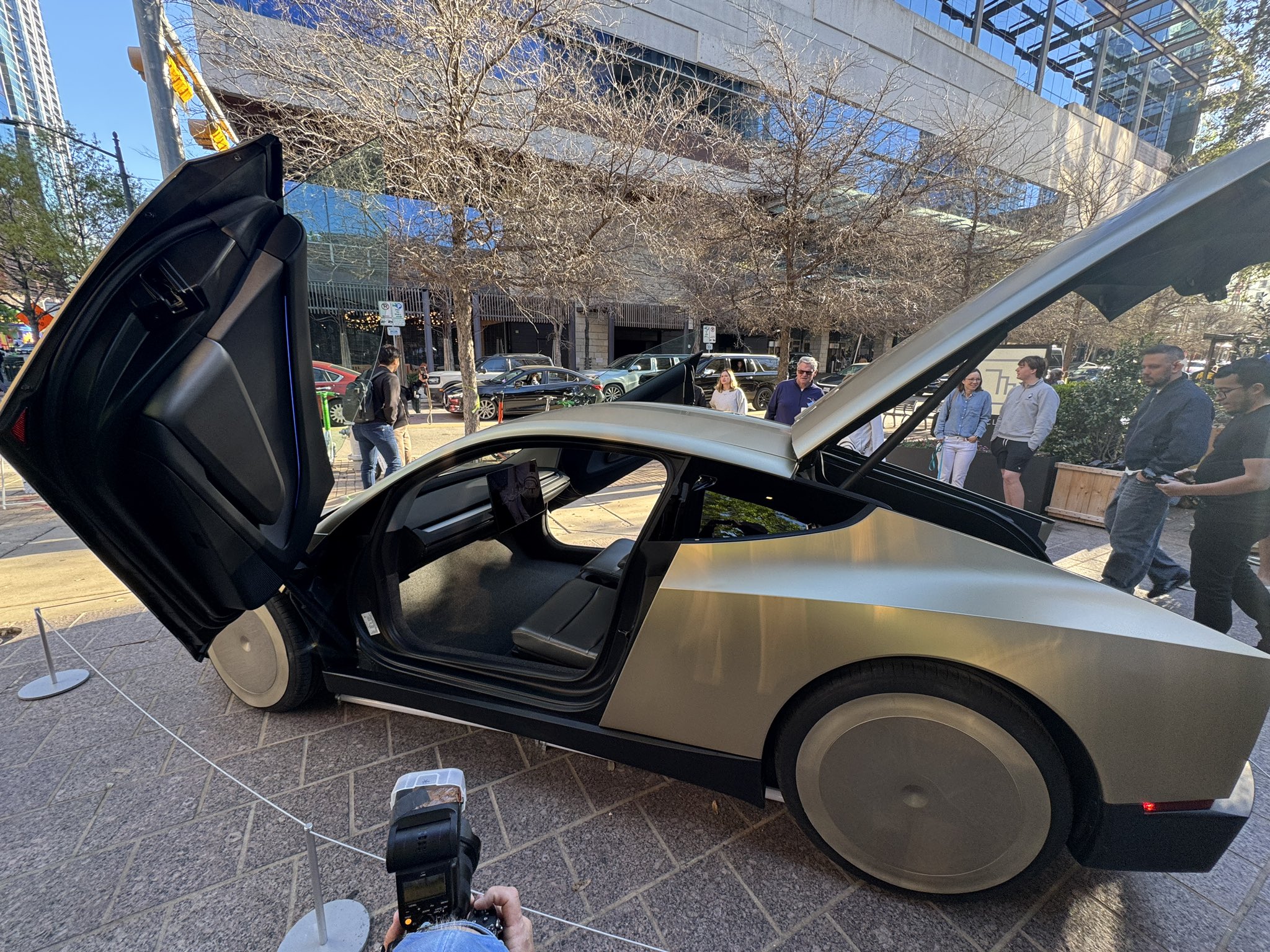 Tesla CyberCab side profile with door open
